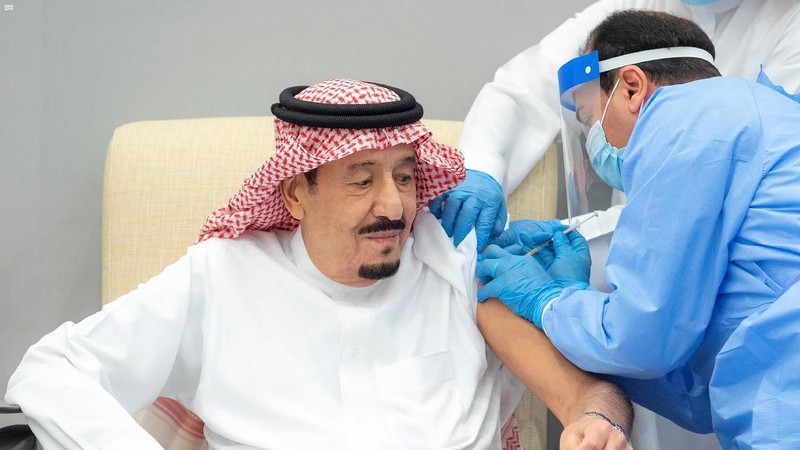 In this photo released by Saudi Press Agency, SPA, Saudi Arabia's King Salman receives the first dose of the Pfizer COVID-19 vaccine in Neom, Saudi Arabia, Friday, Jan. 8, 2021. (Saudi Press Agency via AP)