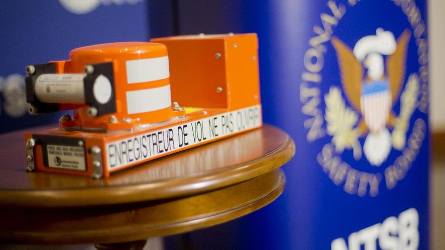 The black box retrieved from Dec. 8, crash of an Embraer EMB-500/Phenom 100 in Gaithersburg, Md., is displayed at NTSB headquarters in Washington, Tuesday, Dec. 9, 2014. The aircraft crashed in a residential neighborhood in Gaithersburg, Md. (AP Photo/Pablo Martinez Monsivais)