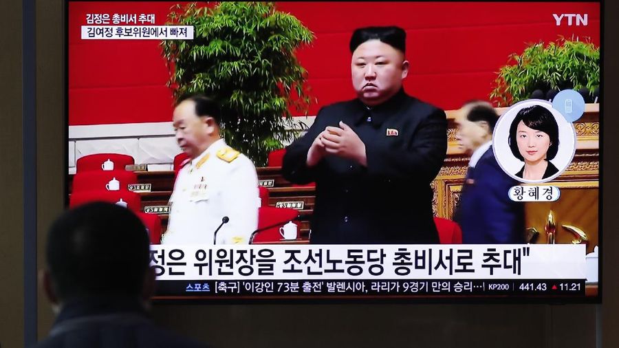 A man watches a TV screen showing a footage of North Korean leader Kim Jong Un, at the Seoul Railway Station in Seoul, South Korea, Monday, Jan. 11, 2021. A part of letters read