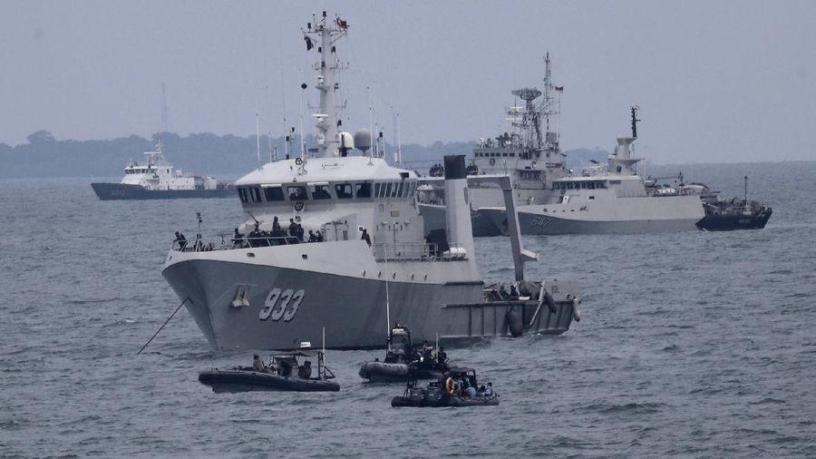 Indonesian Navy ships continue their search for the wreckage of Sriwijaya Air passenger jet that crashed into Java Sea near Jakarta, Indonesia, Monday, Jan. 11, 2021. Indonesian navy divers scoured the floor of the Java Sea on Monday as they hunted for the black boxes of a Sriwijaya Air jet that nosedived into the waters at high velocity with dozens of people aboard. (AP Photo/Tatan Syuflana)