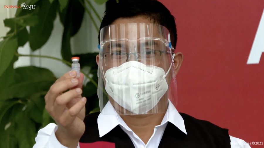 In this photo released by the Indonesian Presidential Palace, President Joko Widodo prepares to receive a shot of COVID-19 vaccine at Merdeka Palace in Jakarta, Indonesia, Wednesday, Jan. 13, 2021. Widodo on Wednesday received the first shot of a Chinese-made COVID-19 vaccine after Indonesia approved it for emergency use and began efforts to vaccine millions of people in the world's fourth most populated country. Writings on the banner in the background read 