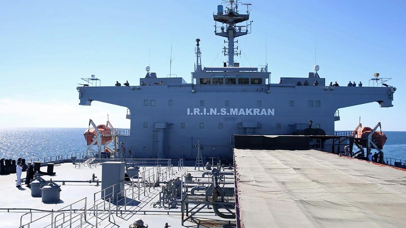 This image made from a video released on Wednesday, Jan. 13, 2021, by the Iranian Army shows troops leaving a helicopter on Makran logistics vessel during a navy drill. Iran's navy began a short-range missile drill in the Gulf of Oman on Wednesday, state TV reported, amid heightened regional tensions over Tehran's nuclear program and a U.S. pressure campaign against the Islamic Republic. (Iranian Army via AP)