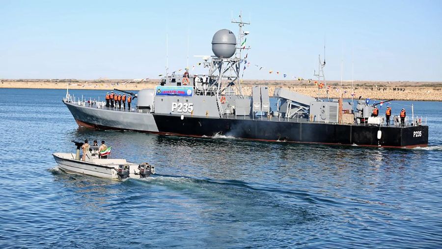 This image made from a video released on Wednesday, Jan. 13, 2021, by the Iranian Army shows troops leaving a helicopter on Makran logistics vessel during a navy drill. Iran's navy began a short-range missile drill in the Gulf of Oman on Wednesday, state TV reported, amid heightened regional tensions over Tehran's nuclear program and a U.S. pressure campaign against the Islamic Republic. (Iranian Army via AP)
