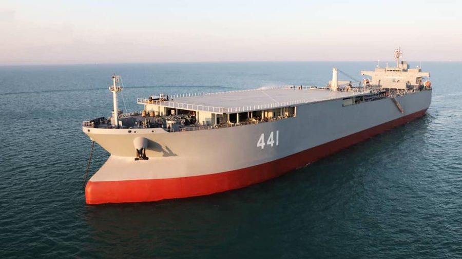This image made from a video released on Wednesday, Jan. 13, 2021, by the Iranian Army shows troops leaving a helicopter on Makran logistics vessel during a navy drill. Iran's navy began a short-range missile drill in the Gulf of Oman on Wednesday, state TV reported, amid heightened regional tensions over Tehran's nuclear program and a U.S. pressure campaign against the Islamic Republic. (Iranian Army via AP)