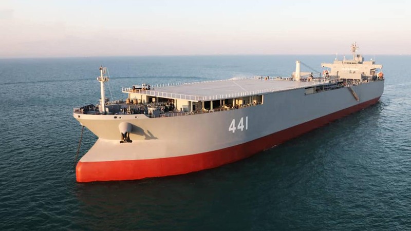 This image made from a video released on Wednesday, Jan. 13, 2021, by the Iranian Army shows troops leaving a helicopter on Makran logistics vessel during a navy drill. Iran's navy began a short-range missile drill in the Gulf of Oman on Wednesday, state TV reported, amid heightened regional tensions over Tehran's nuclear program and a U.S. pressure campaign against the Islamic Republic. (Iranian Army via AP)