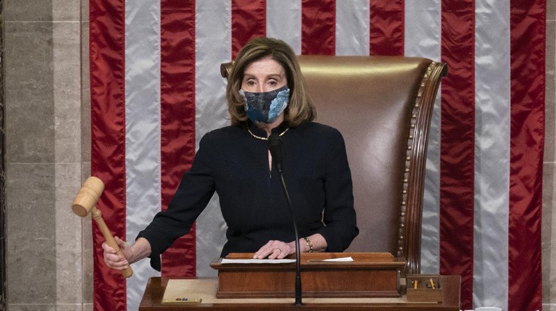 Speaker of the House Nancy Pelosi, D-Calif., leads the final vote of the impeachment of President Donald Trump for his role in inciting an angry mob to storm the Congress last week, at the Capitol in Washington, Wednesday, Jan. 13, 2021. (AP Photo/J. Scott Applewhite)