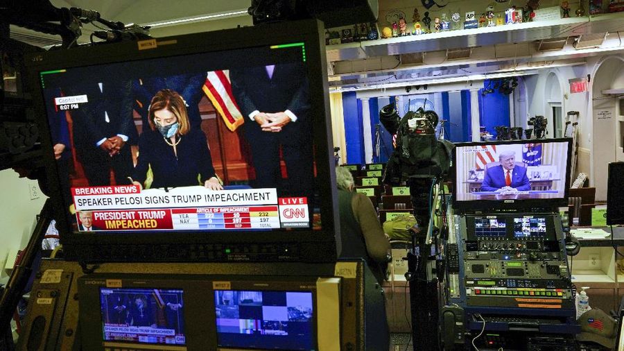 Speaker of the House Nancy Pelosi, D-Calif., leads the final vote of the impeachment of President Donald Trump for his role in inciting an angry mob to storm the Congress last week, at the Capitol in Washington, Wednesday, Jan. 13, 2021. (AP Photo/J. Scott Applewhite)