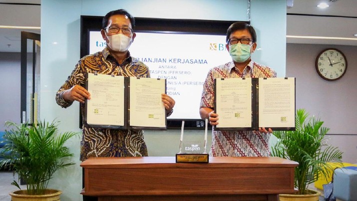 Direktur Hubungan Kelembagaan BNI Sis Apik Wijayanto (kiri) dan Direktur Keuangan Taspen Patar Sitanggang (kanan) menandatangani Perjanjian Kerjasama Kustodian di Jakarta, (15 Januari 2021). BNI mendapatkan kepercayaan menjadi pemberi jasa kustodian untuk mengelola asset-aset Taspen. Asset Under Custody (AUC) BNI per bulan Desember 2020 mencapai Rp 270,5 triliun dengan total nasabah mencapai lebih dari 200 institusi. 9Dok. BNI) Direktur Hubungan Kelembagaan BNI Sis Apik Wijayanto (kiri) dan Direktur Keuangan Taspen Patar Sitanggang (kanan) menandatangani Perjanjian Kerjasama Kustodian di Jakarta, (15 Januari 2021). BNI mendapatkan kepercayaan menjadi pemberi jasa kustodian untuk mengelola asset-aset Taspen. Asset Under Custody (AUC) BNI per bulan Desember 2020 mencapai Rp 270,5 triliun dengan total nasabah mencapai lebih dari 200 institusi. 9Dok. BNI)
