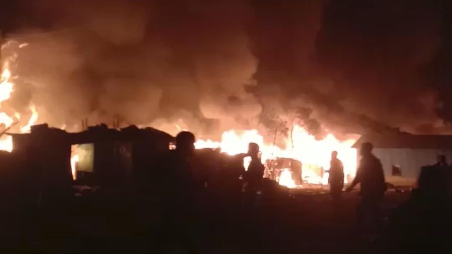 This frame grab from video shows flames rising after a fire broke out in Nayapara Camp in Cox's Bazar district, Bangladesh, Thursday, Jan. 14, 2021. A fire raced through a sprawling Rohingya refugee camp in southern Bangladesh on Thursday, destroying hundreds of homes, officials said. No casualties were reported. The UNHCR said more than 550 homes sheltering about 3,500 people as well as 150 shops were either totally or partially destroyed in the fire.  (AP Photo)