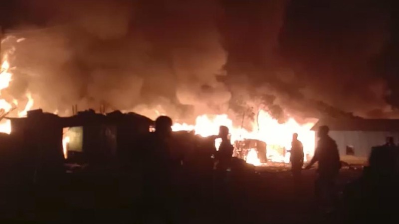 This frame grab from video shows flames rising after a fire broke out in Nayapara Camp in Cox's Bazar district, Bangladesh, Thursday, Jan. 14, 2021. A fire raced through a sprawling Rohingya refugee camp in southern Bangladesh on Thursday, destroying hundreds of homes, officials said. No casualties were reported. The UNHCR said more than 550 homes sheltering about 3,500 people as well as 150 shops were either totally or partially destroyed in the fire.  (AP Photo)