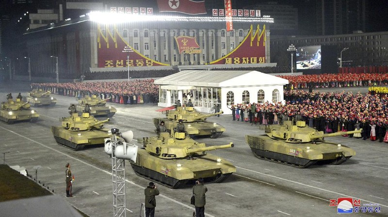 In this photo provided by the North Korean government, North Korean leader Kim Jong Un waves as Kim attended a military parade, marking the ruling party congress, at Kim Il Sung Square in Pyongyang, North Korea Thursday, Jan. 14, 2021. Independent journalists were not given access to cover the event depicted in this image distributed by the North Korean government. The content of this image is as provided and cannot be independently verified. Korean language watermark on image as provided by source reads: 