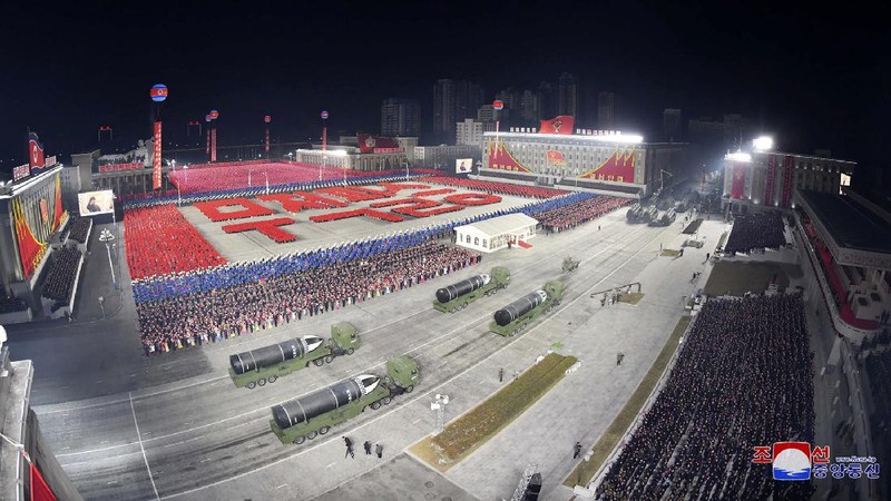 In this photo provided by the North Korean government, North Korean leader Kim Jong Un waves as Kim attended a military parade, marking the ruling party congress, at Kim Il Sung Square in Pyongyang, North Korea Thursday, Jan. 14, 2021. Independent journalists were not given access to cover the event depicted in this image distributed by the North Korean government. The content of this image is as provided and cannot be independently verified. Korean language watermark on image as provided by source reads: 