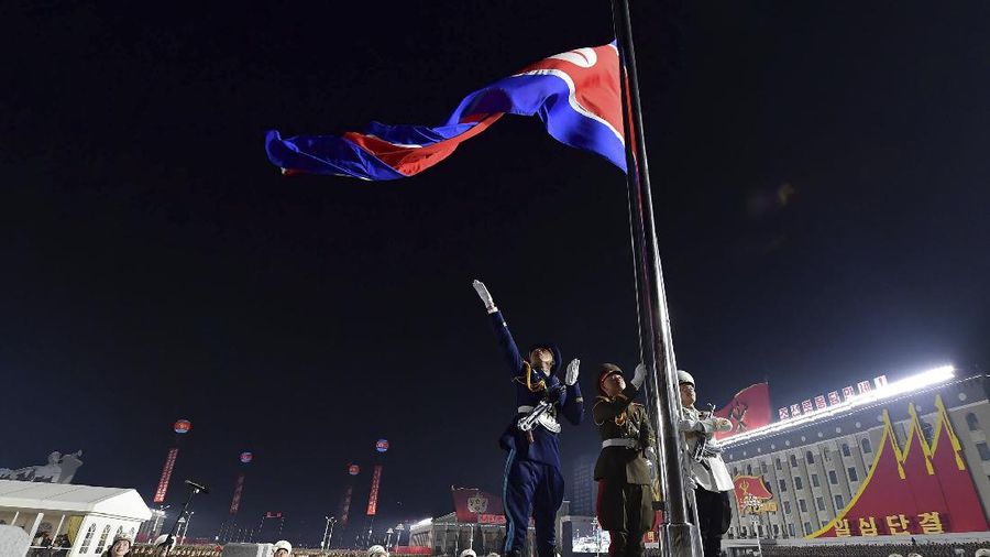 In this photo provided by the North Korean government a North Korean flag is hoisted in the celebration for the ruling party congress, at Kim Il Sung Square in Pyongyang, North Korea Thursday, Jan. 14, 2021. Independent journalists were not given access to cover the event depicted in this image distributed by the North Korean government. The content of this image is as provided and cannot be independently verified. Korean language watermark on image as provided by source reads: 