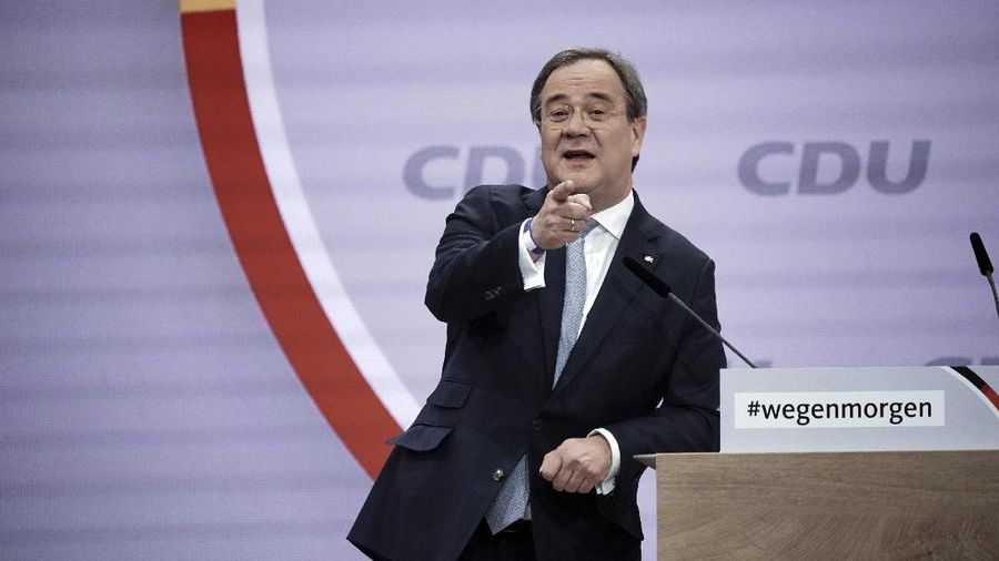Governor of North Rhine-Westphalia and candidate for the party chairmanship, Armin Laschet, speaks at the CDU's digital national party conference. In the studio, the candidates for the party presidency give their candidacy speeches, while the delegates at home follow the event in the livestream. German Chancellor Angela Merkel’s party is choosing a new leader on Saturday, eight months before voters decide who will succeed Merkel in a national election. (Michael Kappeler/dpa via AP)