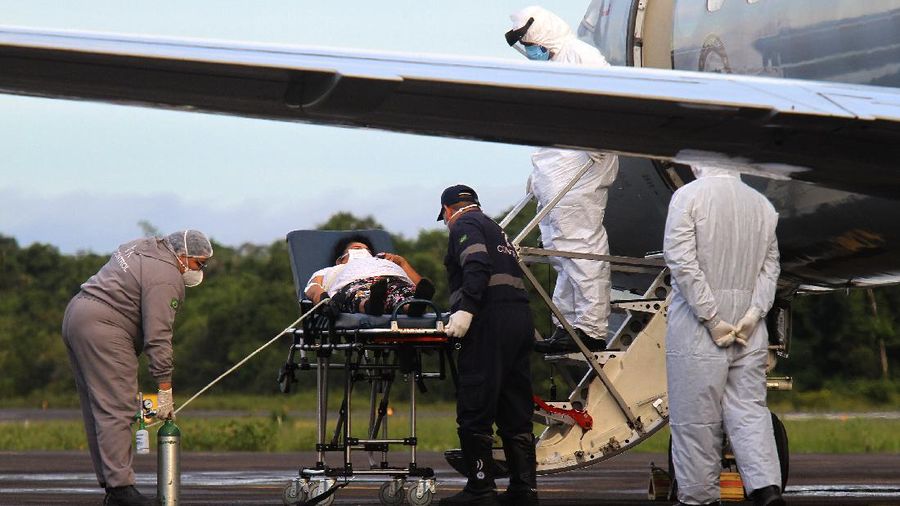 Family members of patients hospitalized with COVID-19 line up with empty oxygen tanks in an attempt to refill them, outside the Nitron da Amazonia company, in Manaus, Amazonas state, Brazil, Friday, Jan. 15, 2021. (AP Photo/Edmar Barros)