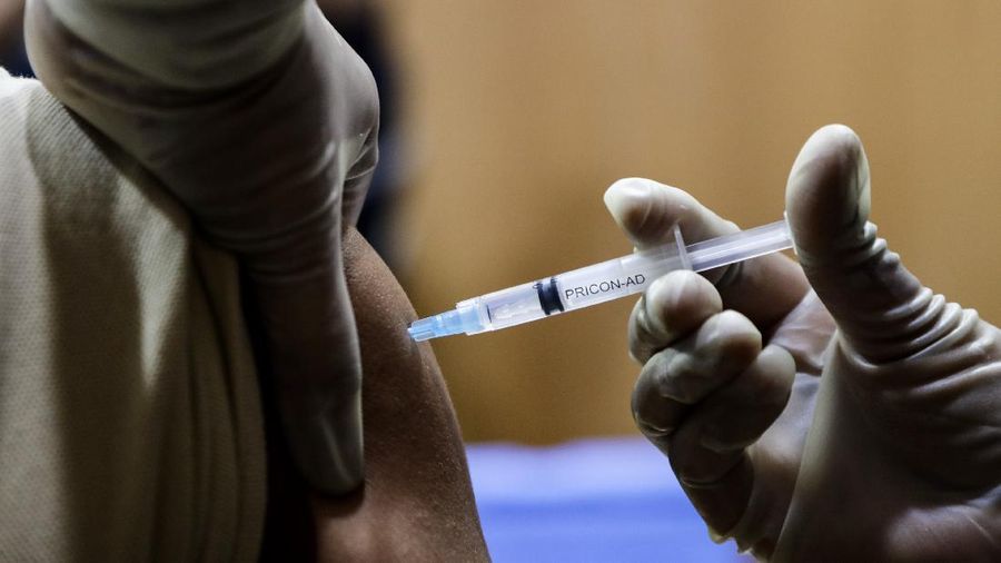 A health worker is being administered COVID-19 vaccine at a hospital in Kolkata, India, Saturday, Jan. 16, 2021. India started inoculating health workers Saturday in what is likely the world's largest COVID-19 vaccination campaign, joining the ranks of wealthier nations where the effort is already well underway. (AP Photo/Bikas Das)