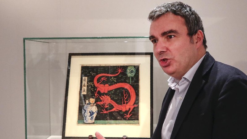 Lukisan Tintin karya seniman asal Belgia, Herge, terjual senilai 3,2 juta euro atau sekitar Rp 66 miliar. (AP/Michel Euler)