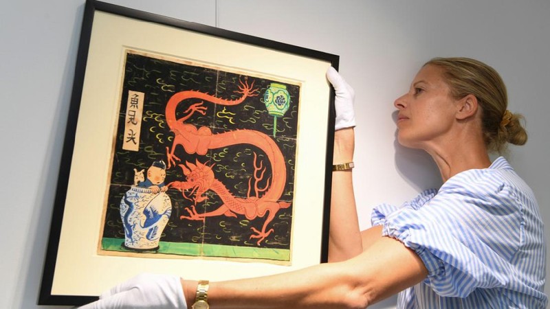 Lukisan Tintin karya seniman asal Belgia, Herge, terjual senilai 3,2 juta euro atau sekitar Rp 66 miliar. (AP/Michel Euler)