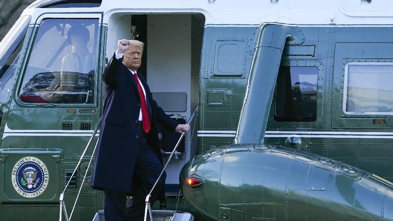 President Donald Trump and first lady Melania Trump walk from the White House to board Marine One on the South Lawn, Wednesday, Jan. 20, 2021, in Washington. Trump is en route to his Mar-a-Lago Florida Resort. (AP Photo/Alex Brandon)
