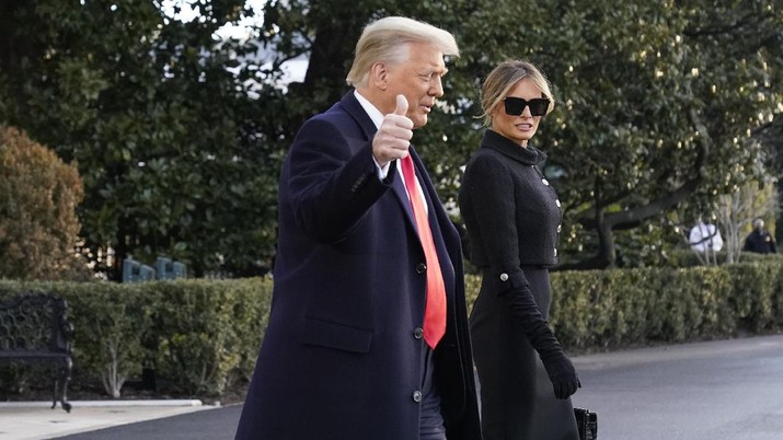 President Donald Trump and first lady Melania Trump walk to board Marine One on the South Lawn of the White House, Wednesday, Jan. 20, 2021, in Washington. Trump is en route to his Mar-a-Lago Florida Resort. (AP Photo/Alex Brandon)