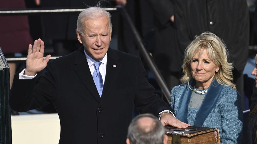 Joe Biden is sworn in as the 46th president of the United States by Chief Justice John Roberts as Jill Biden holds the Bible during the 59th Presidential Inauguration at the U.S. Capitol in Washington, Wednesday, Jan. 20, 2021.(Saul Loeb/Pool Photo via AP)