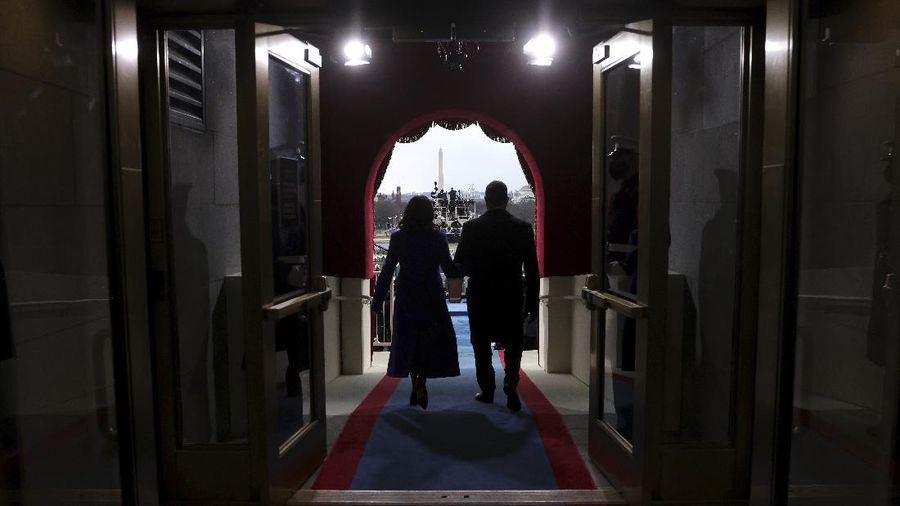 President-elect Joe Biden and his wife Jill, walk out for the 59th Presidential Inauguration at the U.S. Capitol in Washington, Wednesday, Jan. 20, 2021.(AP Photo/Patrick Semansky, Pool)