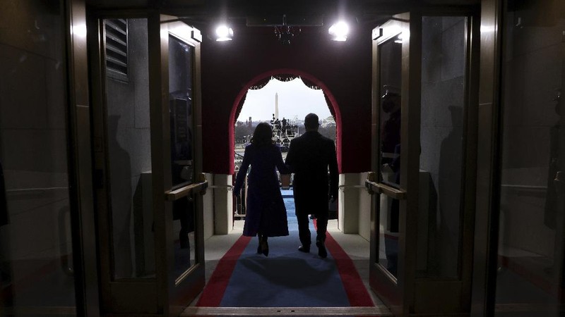 President-elect Joe Biden and his wife Jill, walk out for the 59th Presidential Inauguration at the U.S. Capitol in Washington, Wednesday, Jan. 20, 2021.(AP Photo/Patrick Semansky, Pool)