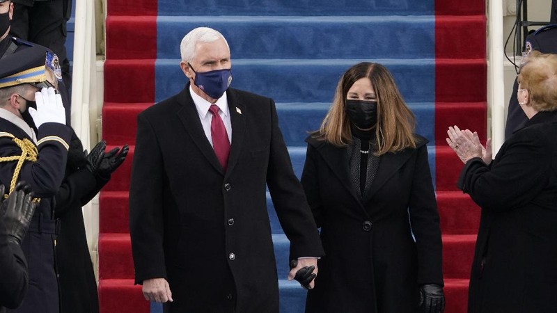 President-elect Joe Biden and his wife Jill, walk out for the 59th Presidential Inauguration at the U.S. Capitol in Washington, Wednesday, Jan. 20, 2021.(AP Photo/Patrick Semansky, Pool)