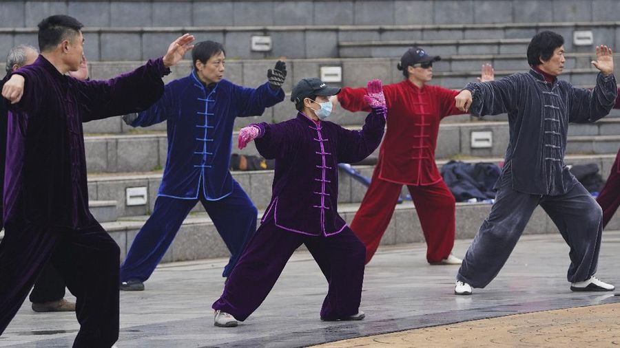 Residents practice Taiji at a park in Wuhan in central China's Hubei Province on Saturday, Jan. 23, 2021. A year after it was locked down to contain the spread of coronavirus, the central Chinese city of Wuhan has largely returned to normal, even as China continues to battle outbreaks elsewhere in the country. (AP Photo/Ng Han Guan)