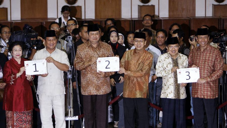 FILE--Megawati Sukarnoputri, left, is embraced by her father and Indonesia's first president Sukarno at the State Palace in Jakarta on Jan. 10, 1960. Megawati, now 54, has assumed her late father's mantle and is set to move back into the palace where she grew up. The legislature removed President Abdurrahman Wahid on Monday, July 23, 2001. Megawati, who had been vice president, was sworn in as president. (AP Photo)