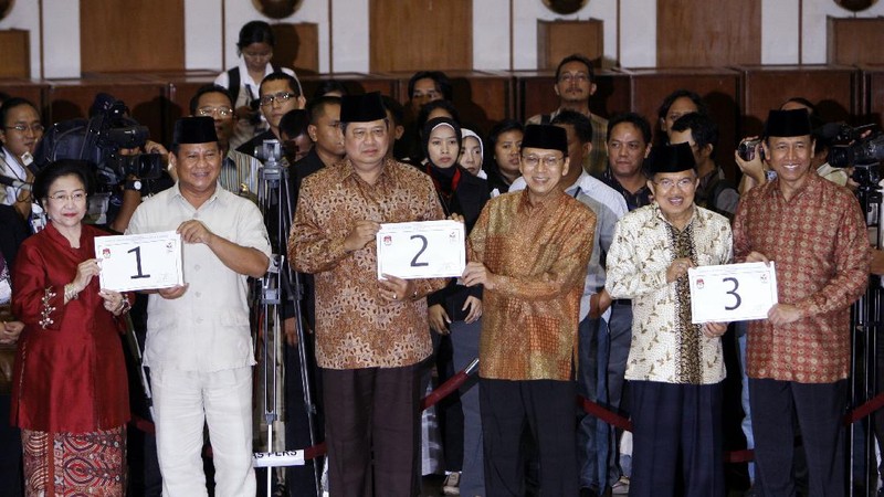 FILE--Megawati Sukarnoputri, left, is embraced by her father and Indonesia's first president Sukarno at the State Palace in Jakarta on Jan. 10, 1960. Megawati, now 54, has assumed her late father's mantle and is set to move back into the palace where she grew up. The legislature removed President Abdurrahman Wahid on Monday, July 23, 2001. Megawati, who had been vice president, was sworn in as president. (AP Photo)