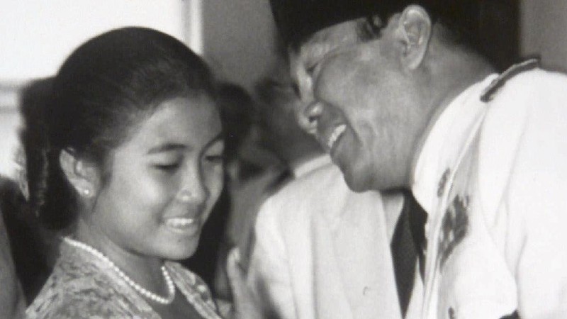 FILE--Megawati Sukarnoputri, left, is embraced by her father and Indonesia's first president Sukarno at the State Palace in Jakarta on Jan. 10, 1960. Megawati, now 54, has assumed her late father's mantle and is set to move back into the palace where she grew up. The legislature removed President Abdurrahman Wahid on Monday, July 23, 2001. Megawati, who had been vice president, was sworn in as president. (AP Photo)