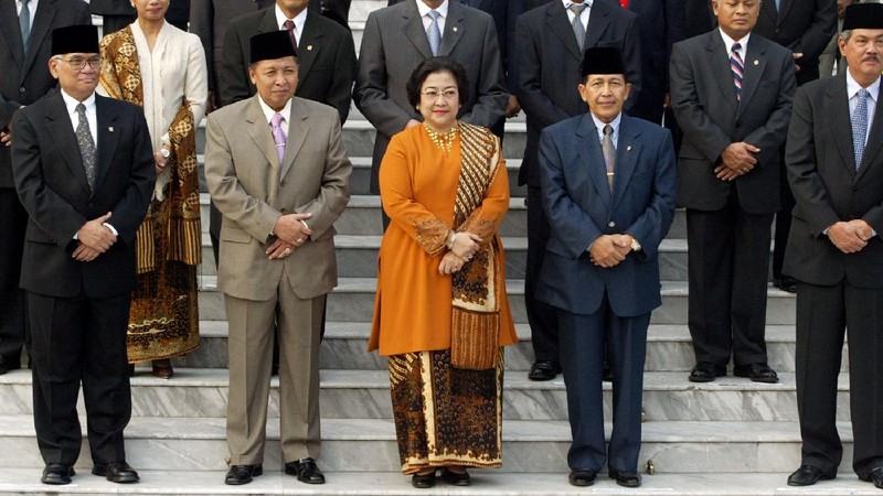 FILE--Megawati Sukarnoputri, left, is embraced by her father and Indonesia's first president Sukarno at the State Palace in Jakarta on Jan. 10, 1960. Megawati, now 54, has assumed her late father's mantle and is set to move back into the palace where she grew up. The legislature removed President Abdurrahman Wahid on Monday, July 23, 2001. Megawati, who had been vice president, was sworn in as president. (AP Photo)