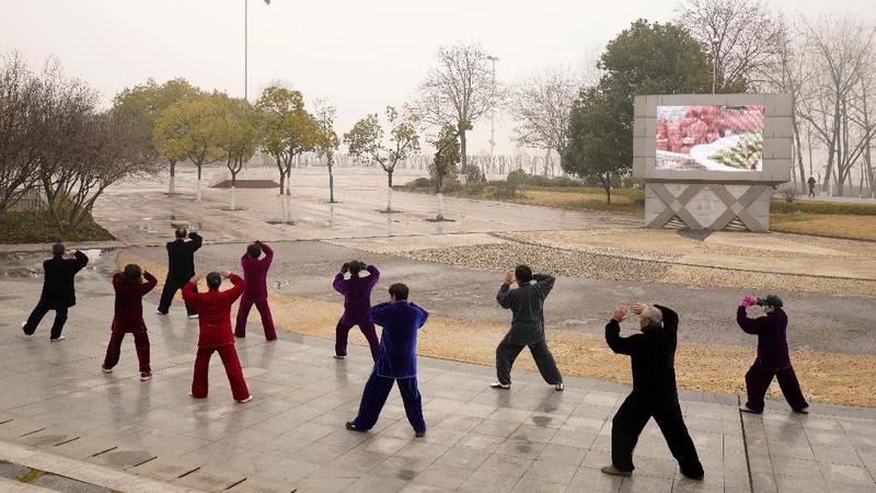 Residents practice Taiji at a park in Wuhan in central China's Hubei Province on Saturday, Jan. 23, 2021. A year after it was locked down to contain the spread of coronavirus, the central Chinese city of Wuhan has largely returned to normal, even as China continues to battle outbreaks elsewhere in the country. (AP Photo/Ng Han Guan)