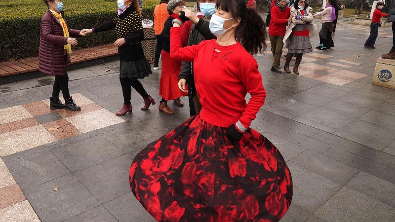 Residents practice Taiji at a park in Wuhan in central China's Hubei Province on Saturday, Jan. 23, 2021. A year after it was locked down to contain the spread of coronavirus, the central Chinese city of Wuhan has largely returned to normal, even as China continues to battle outbreaks elsewhere in the country. (AP Photo/Ng Han Guan)