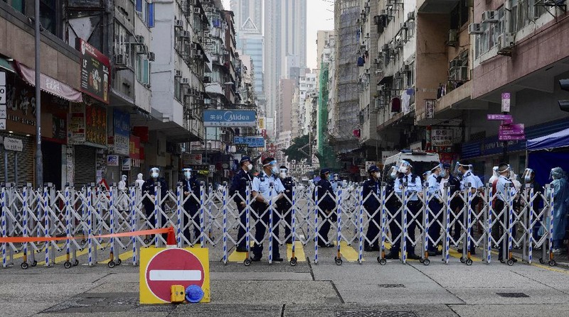 A closed area of Jordan district is seen in Hong Kong, Saturday, Jan. 23, 2021. Thousands of Hong Kong residents were locked down Saturday in an unprecedented move to contain a worsening outbreak in the city, authorities said. (AP Photo/Kin Cheung)