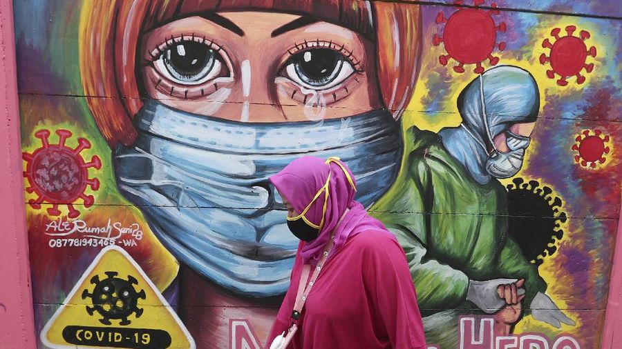 Ilustrasi mural covid. (AP/Tatan Syuflana)