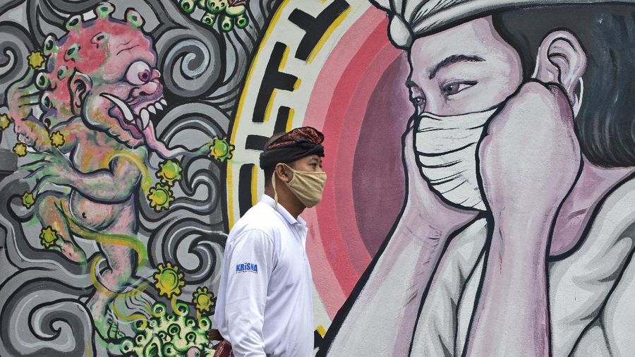 Ilustrasi mural covid. (AP/Tatan Syuflana)