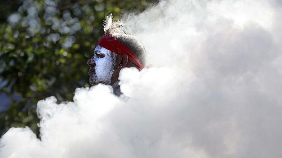 Protes peringatan hari nasional Australia. (AP/Rick Rycroft)