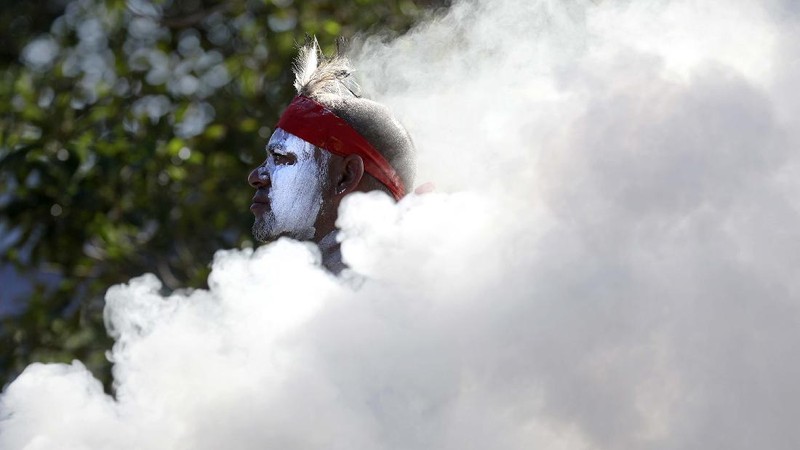 Protes peringatan hari nasional Australia. (AP/Rick Rycroft)