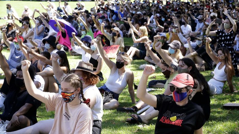 Protes peringatan hari nasional Australia. (AP/Rick Rycroft)