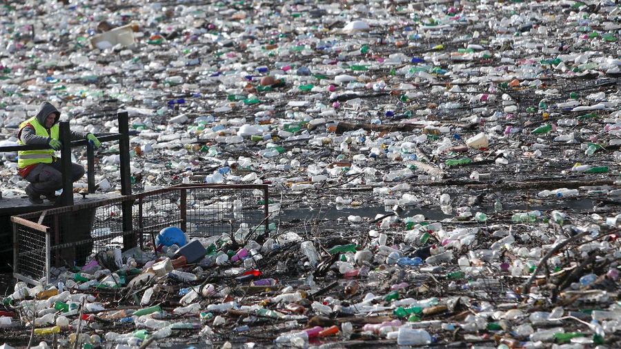 Plastic bottles and other garbage floats in the Potpecko lake near Priboj, in southwest Serbia, Friday, Jan. 22, 2021. Serbia and other Balkan nations are virtually drowning in communal waste after decades of neglect and lack of efficient waste-management policies in the countries aspiring to join the European Union. (AP Photo/Darko Vojinovic)