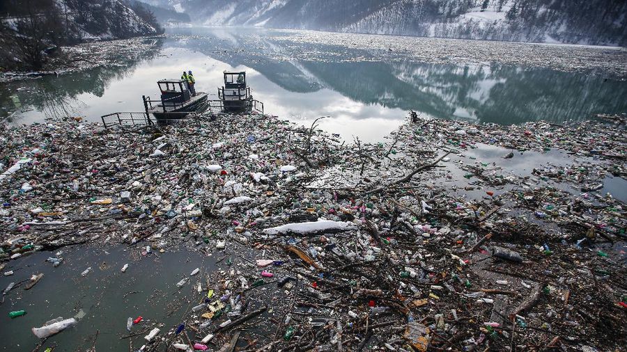 Plastic bottles and other garbage floats in the Potpecko lake near Priboj, in southwest Serbia, Friday, Jan. 22, 2021. Serbia and other Balkan nations are virtually drowning in communal waste after decades of neglect and lack of efficient waste-management policies in the countries aspiring to join the European Union. (AP Photo/Darko Vojinovic)