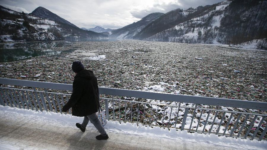 Plastic bottles and other garbage floats in the Potpecko lake near Priboj, in southwest Serbia, Friday, Jan. 22, 2021. Serbia and other Balkan nations are virtually drowning in communal waste after decades of neglect and lack of efficient waste-management policies in the countries aspiring to join the European Union. (AP Photo/Darko Vojinovic)