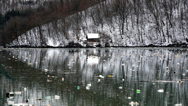 Plastic bottles and other garbage floats in the Potpecko lake near Priboj, in southwest Serbia, Friday, Jan. 22, 2021. Serbia and other Balkan nations are virtually drowning in communal waste after decades of neglect and lack of efficient waste-management policies in the countries aspiring to join the European Union. (AP Photo/Darko Vojinovic)