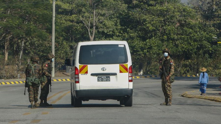 Myanmar soldiers stand guard on a road in Naypyitaw, Myanmar, Tuesday, Feb. 2, 2021. Hundreds of members of Myanmar's Parliament remained confined inside their government housing in the country's capital on Tuesday, a day after the military staged a coup and detained senior politicians including Nobel laureate and de facto leader Aung San Suu Kyi. (AP Photo)