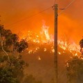 In this photo provided by Department of Fire and Emergency Services, fire burns on a hill at Wooroloo, near Perth, Australia, Monday, Feb. 1, 2021. An out-of-control wildfire burning northeast of the Australian west coast city of Perth has destroyed