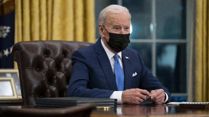 President Joe Biden delivers remarks on immigration, in the Oval Office of the White House, Tuesday, Feb. 2, 2021, in Washington. (AP Photo/Evan Vucci)