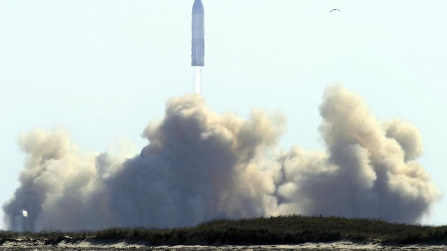 SpaceX's bullet-shaped Starship prototype rotates after a successful liftoff during a test launch, Tuesday, Feb. 2, 2021, in Boca Chica, Texas. The test flight ended in a fiery crash when the Starship attempted to land. (Miguel Roberts/The Brownsville Herald via AP)