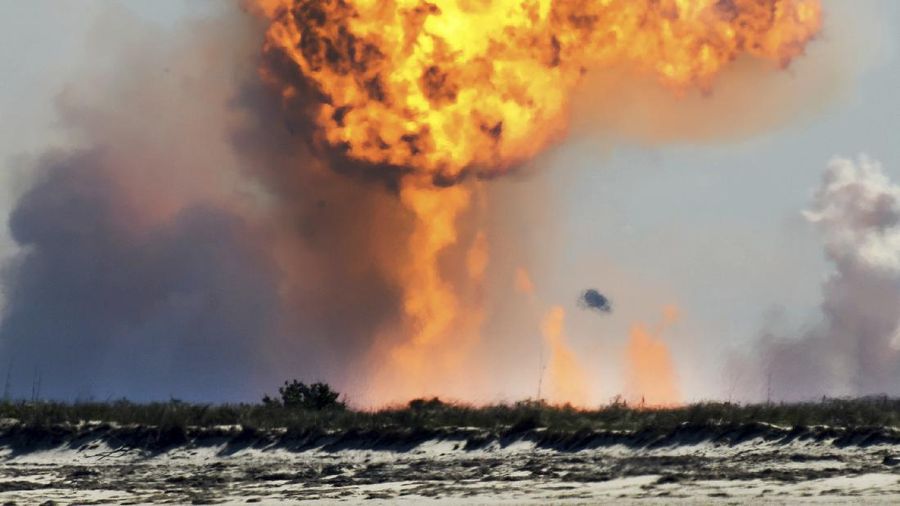 SpaceX's bullet-shaped Starship prototype rotates after a successful liftoff during a test launch, Tuesday, Feb. 2, 2021, in Boca Chica, Texas. The test flight ended in a fiery crash when the Starship attempted to land. (Miguel Roberts/The Brownsville Herald via AP)